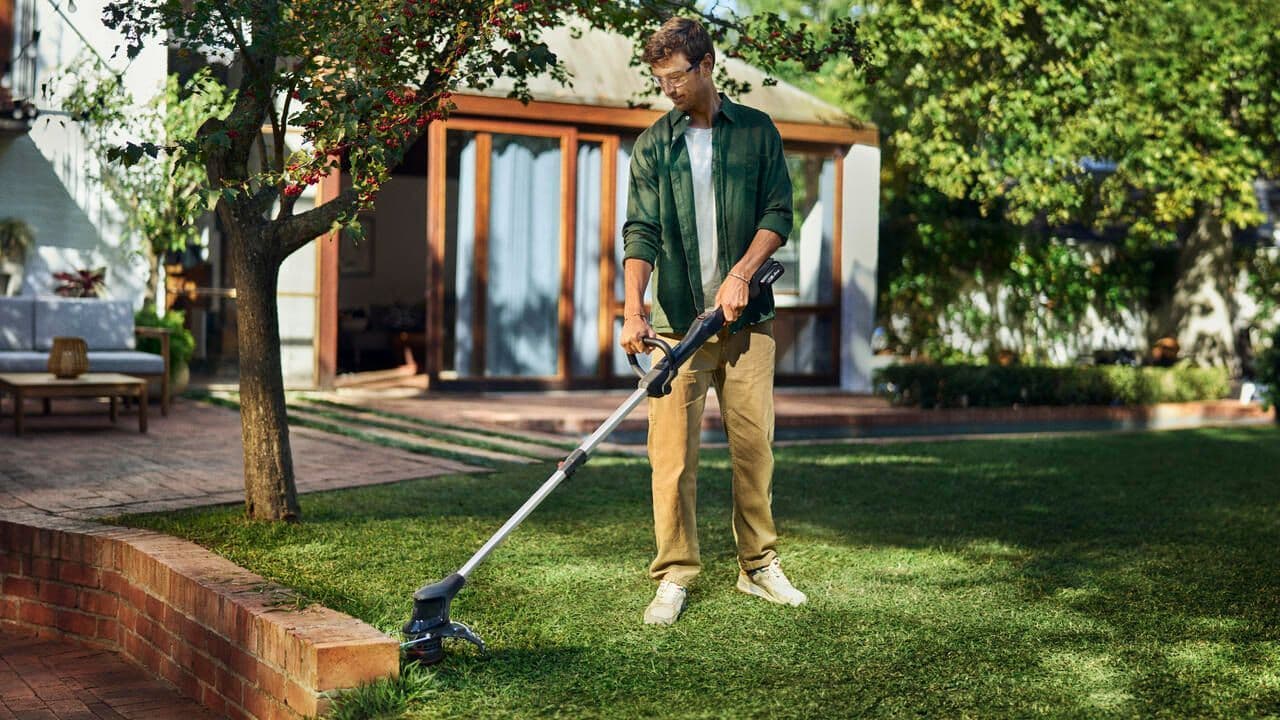 man in backyard using Aspire™ product